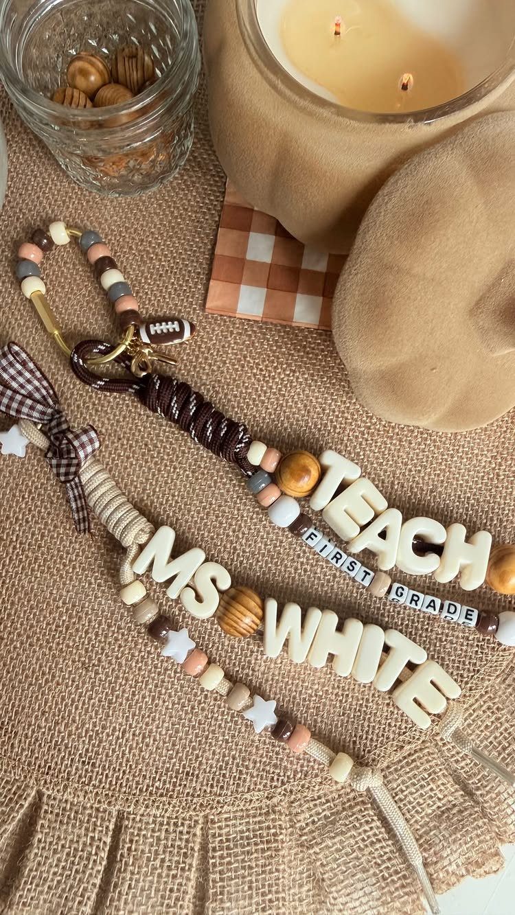 Personalized beaded wristlets for a teacher with name and grade on burlap.