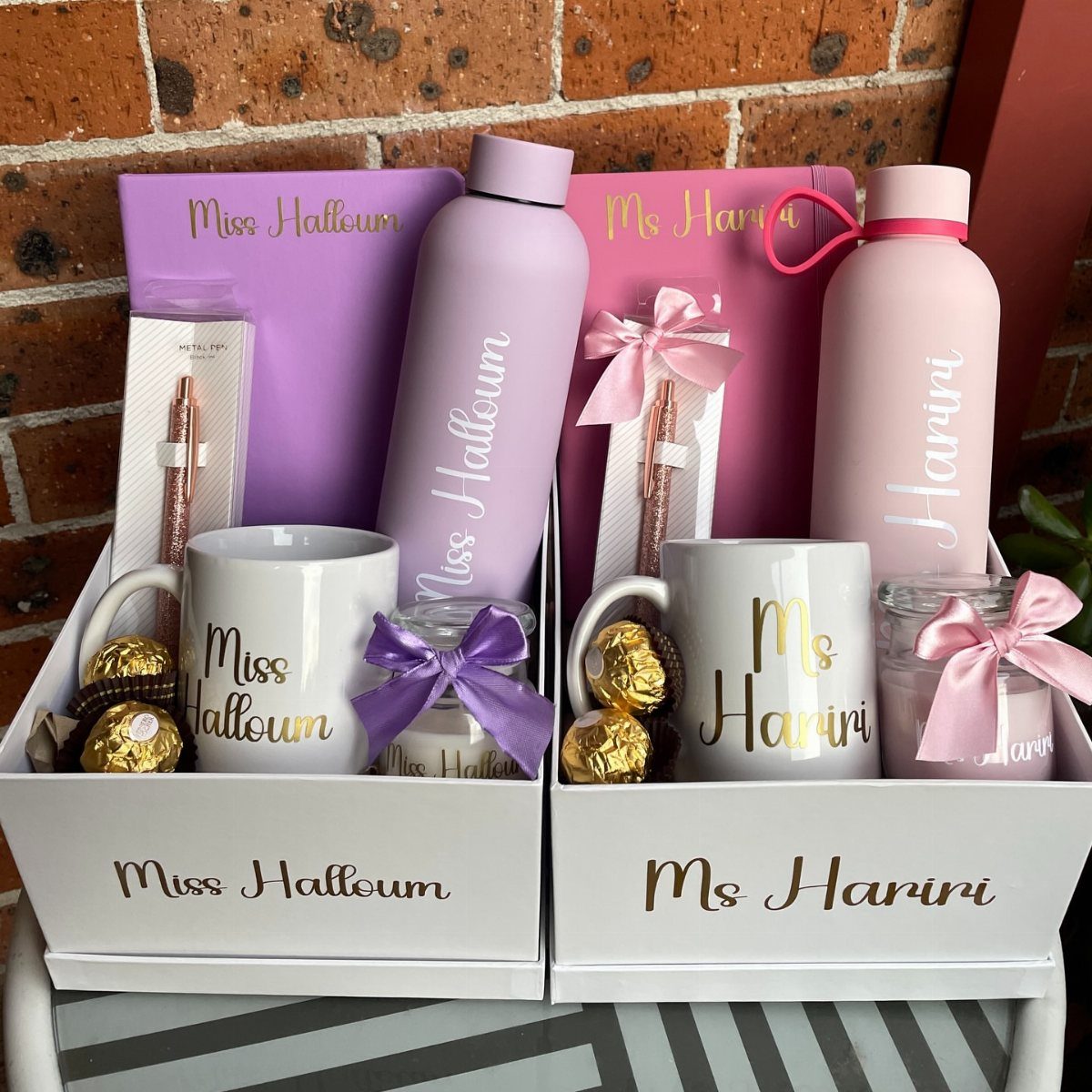 Personalized white mugs and water bottles in gift boxes for teachers.