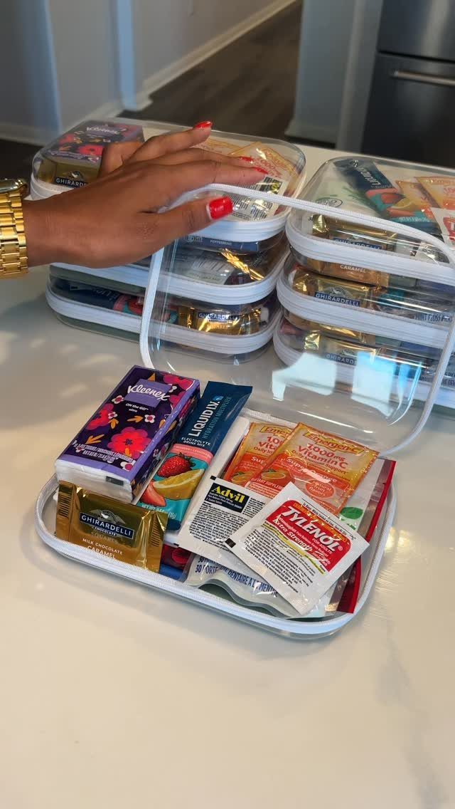 Clear plastic container filled with medicine and snacks as a survival kit.