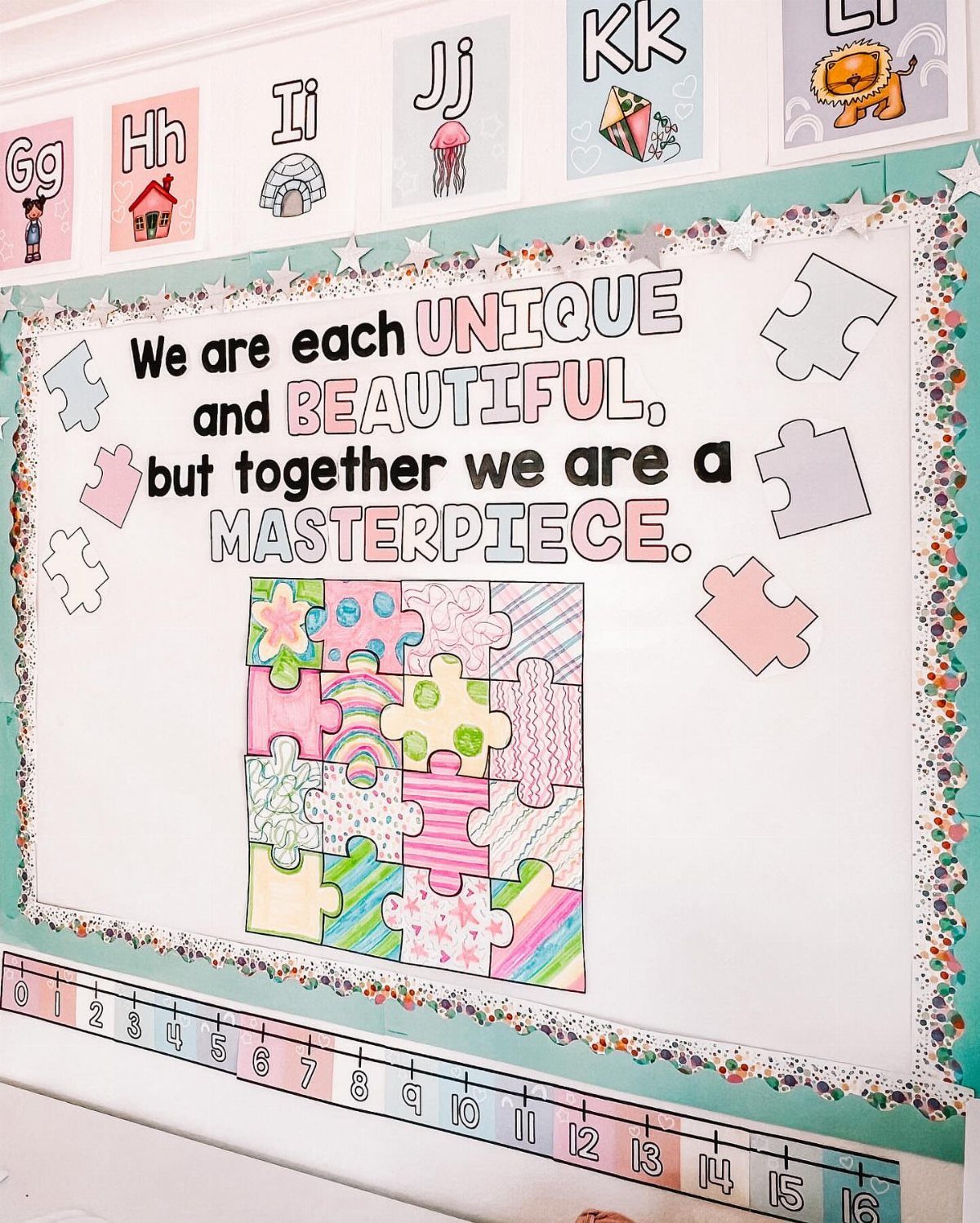 Bulletin board with puzzle pieces and text about being unique and beautiful together.