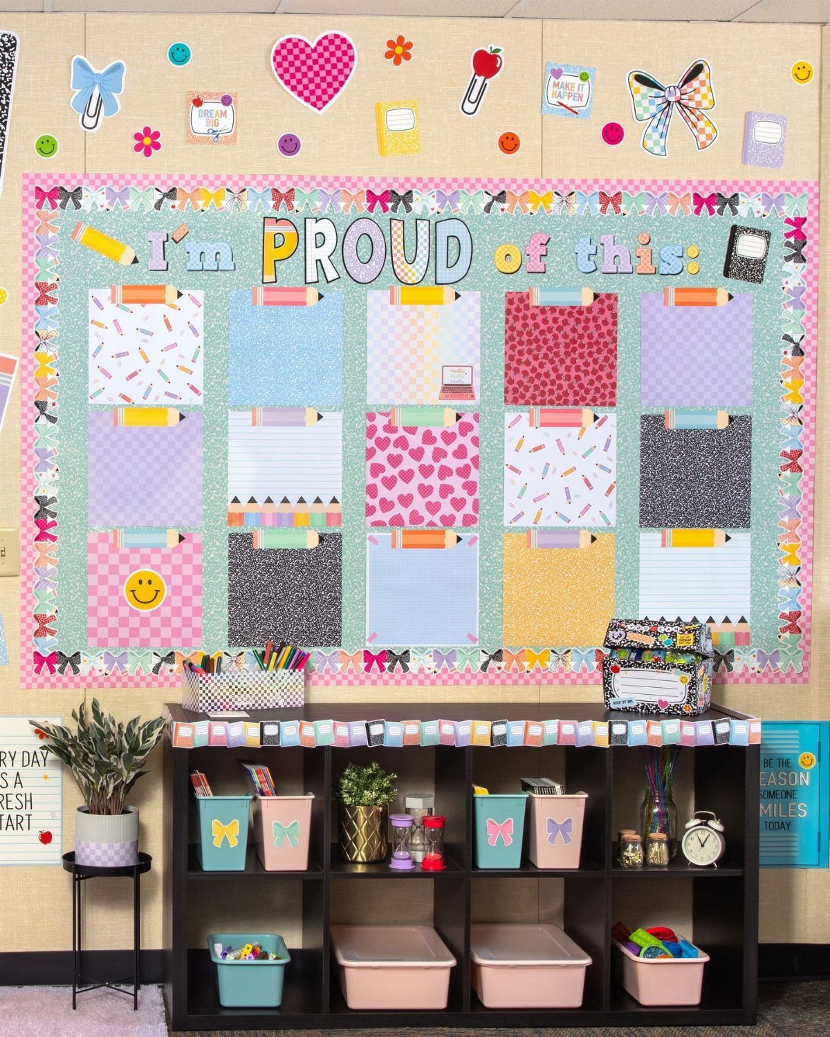 Classroom bulletin board titled I'm PROUD of this with colorful student work placeholders.