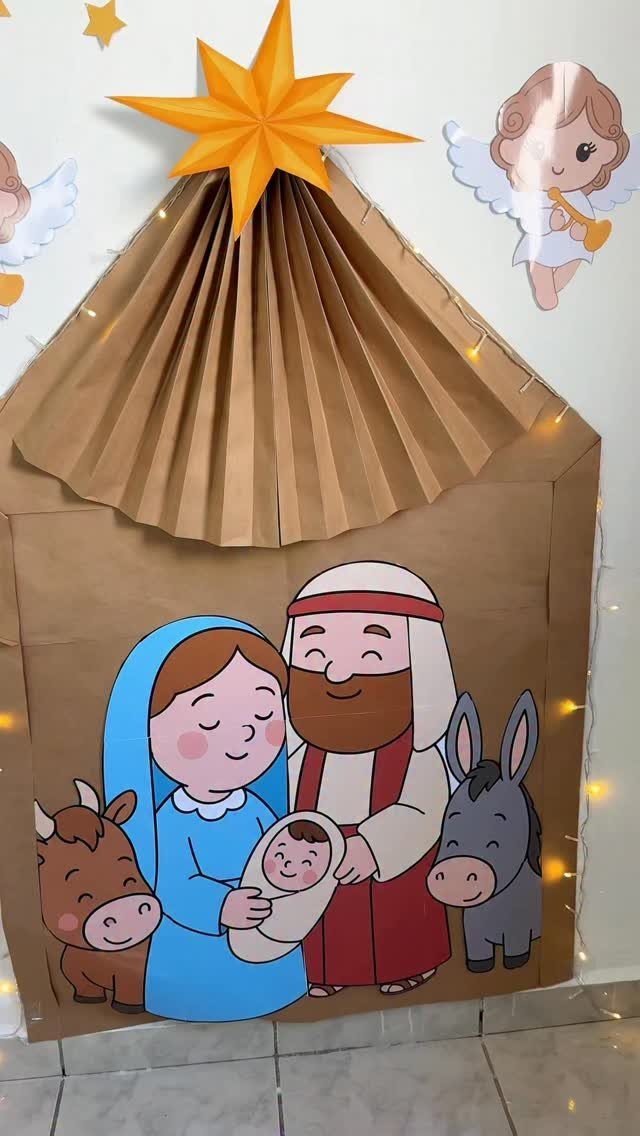 Nativity scene door decoration made from brown paper with cartoon characters and star.