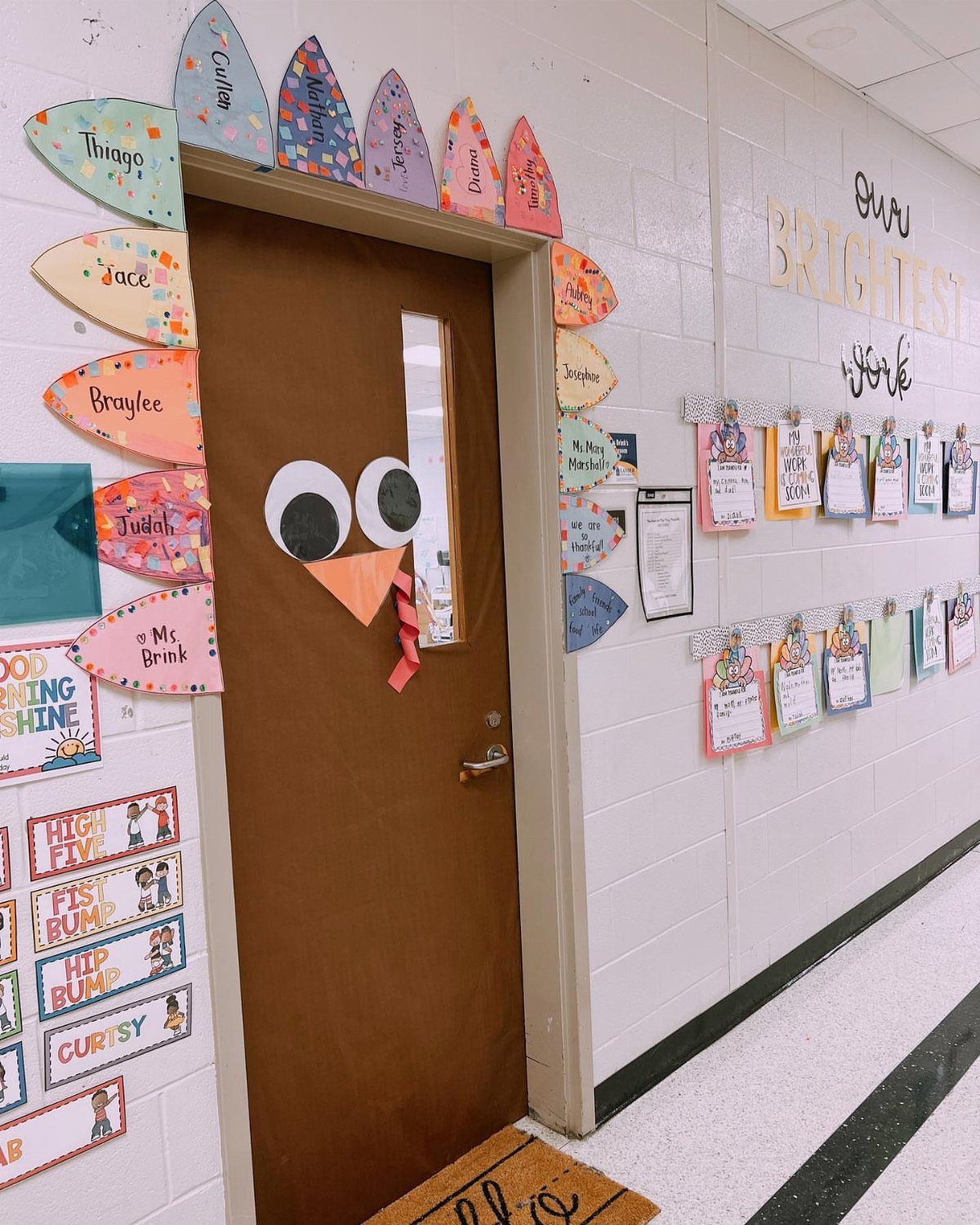 Classroom door decorated as a turkey with colorful feathers and googly eyes.