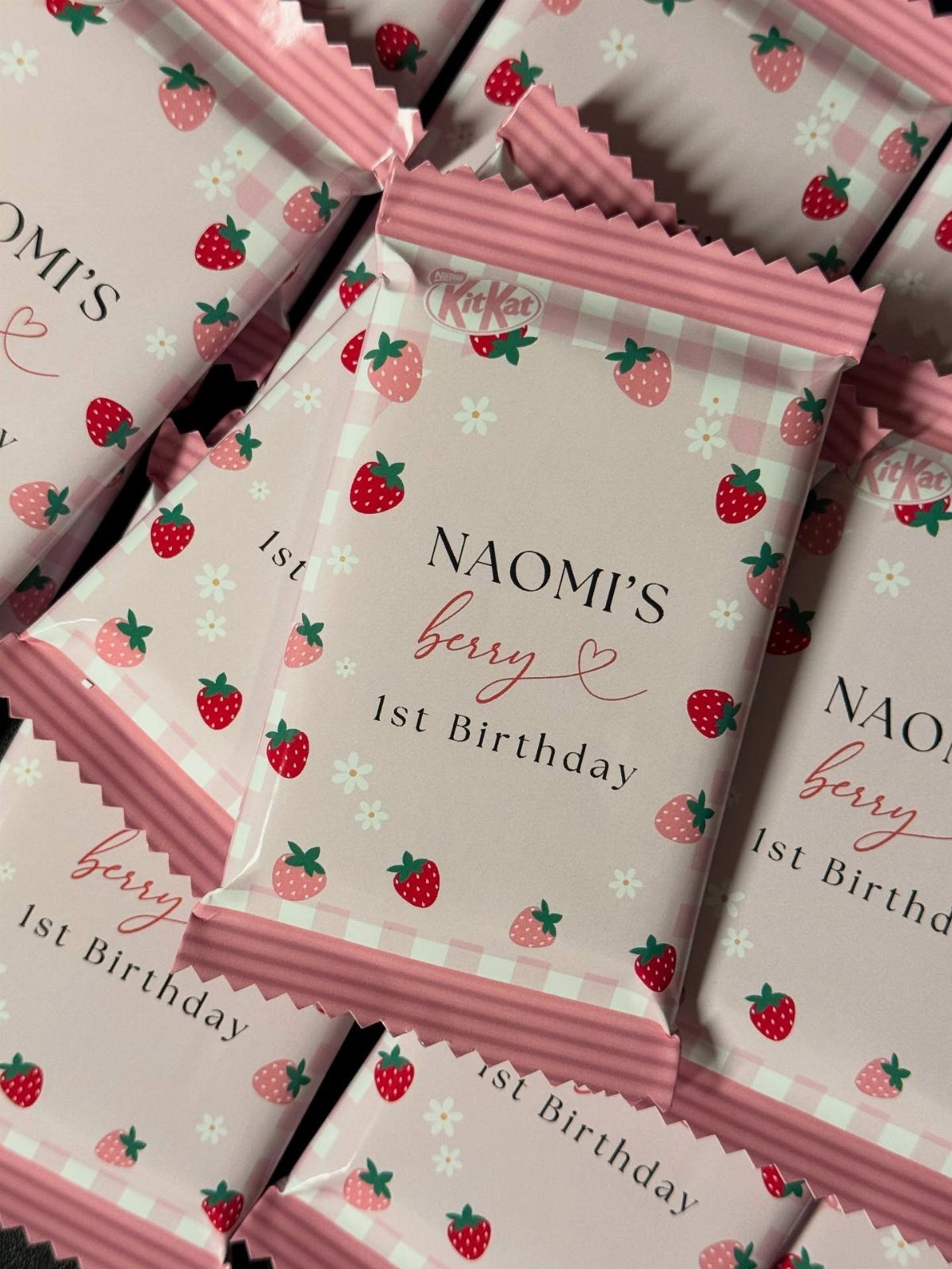 Custom strawberry themed KitKat wrappers for a first birthday party favor.