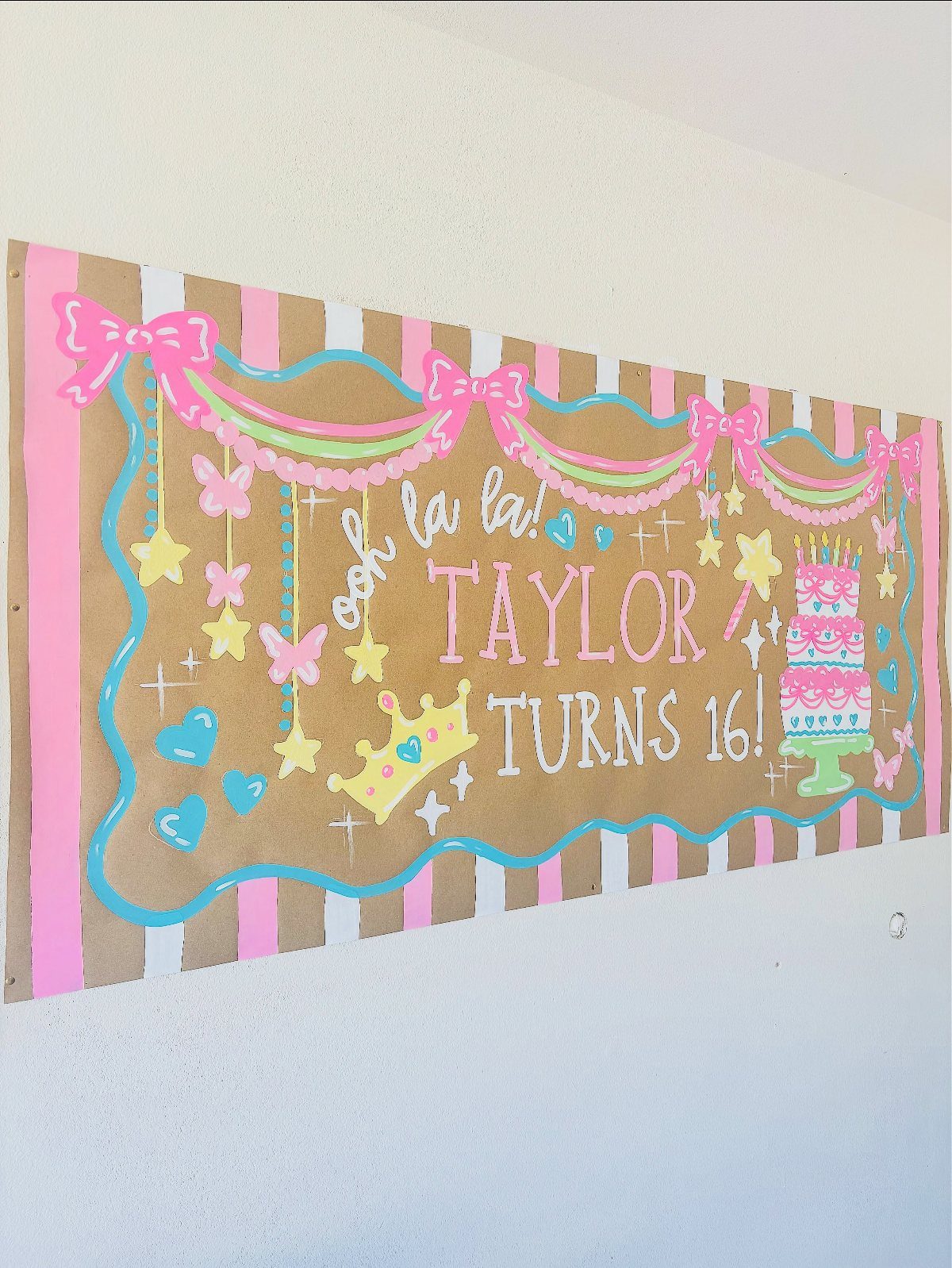 Birthday banner for Taylor's 16th with pink stripes and colorful hand-drawn illustrations.