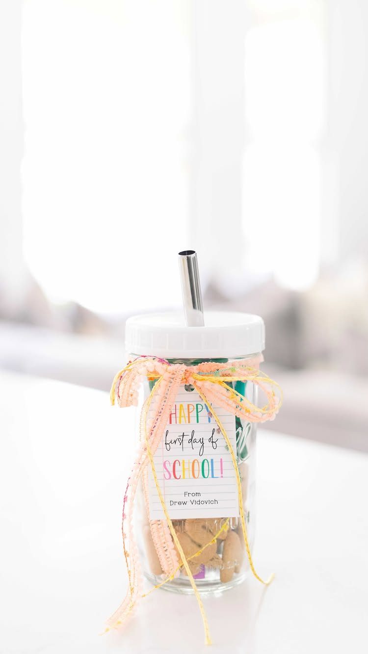 Mason jar filled with treats, featuring a school label and yellow ribbon.