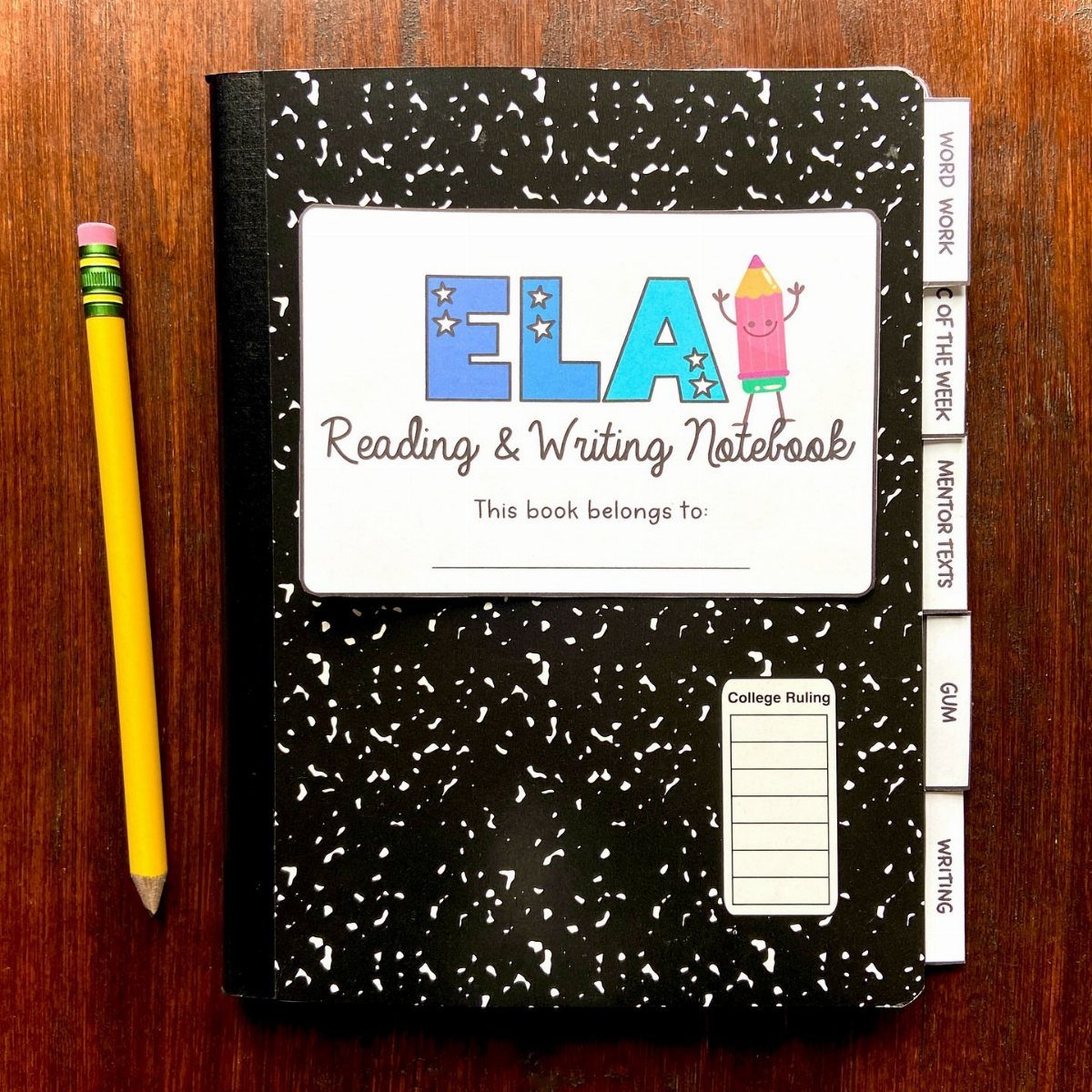 Composition notebook with ELA label and a yellow pencil on wooden table