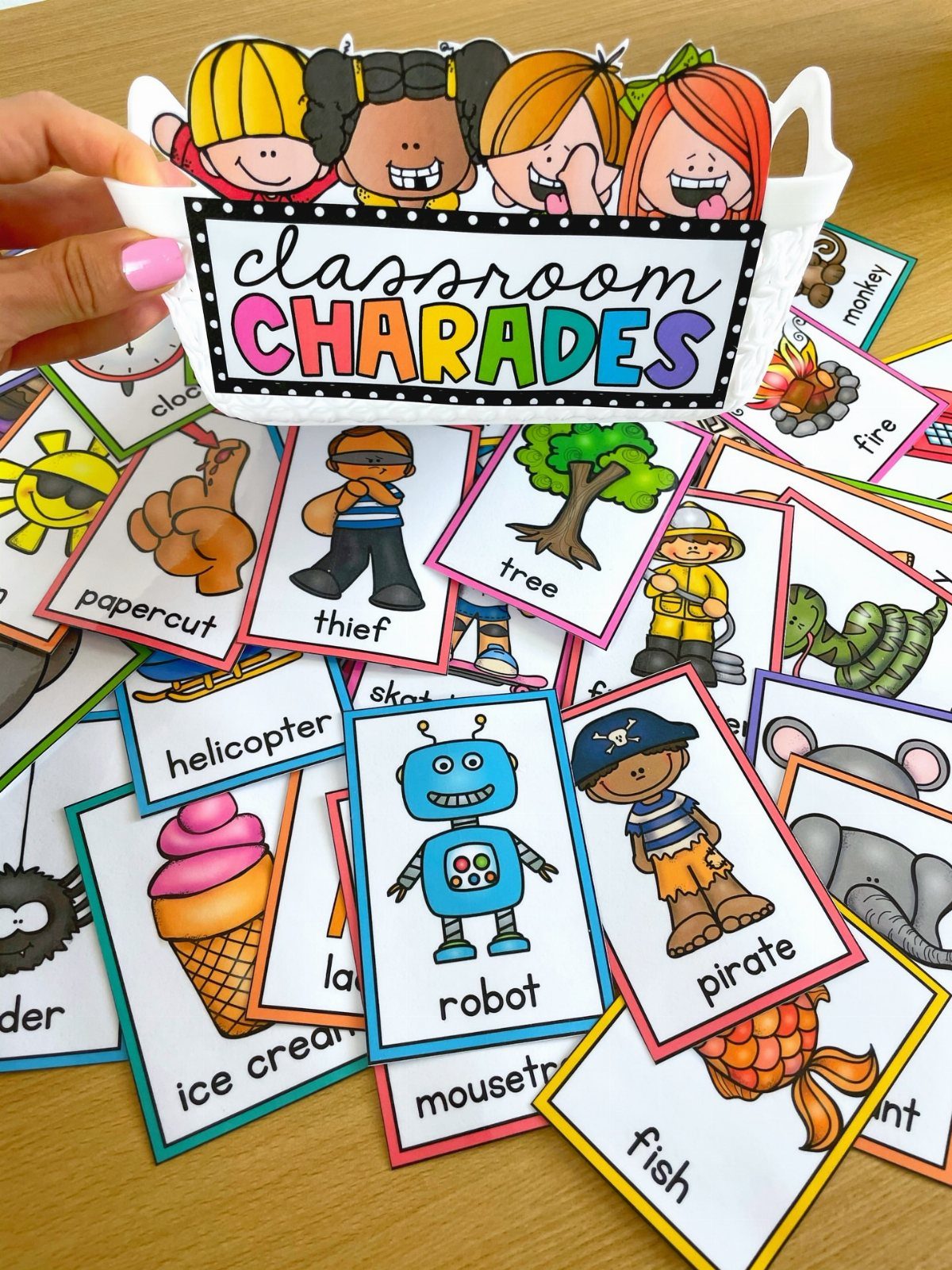 Classroom charades game set with illustrated prompt cards and a themed basket.