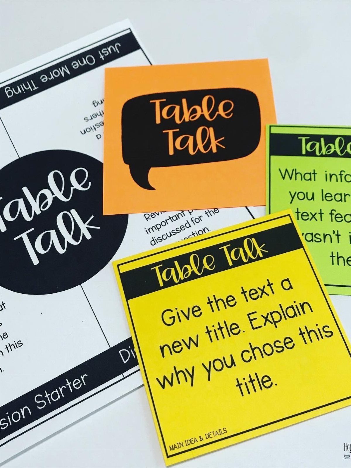 Colorful Table Talk discussion cards and a worksheet on a white background.