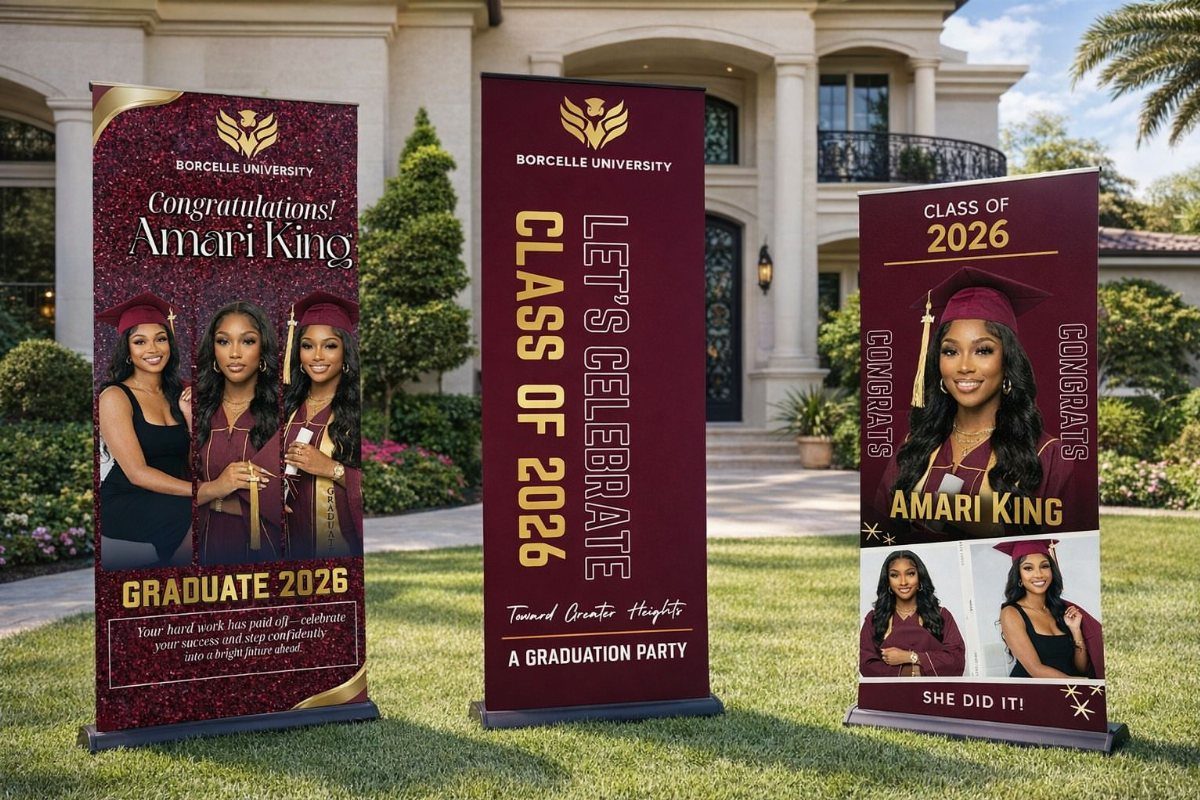 Three maroon graduation banners with photos and name Amari King on a lawn.