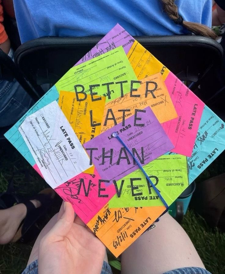 Graduation cap decorated with colorful late pass slips reading Better Late Than Never