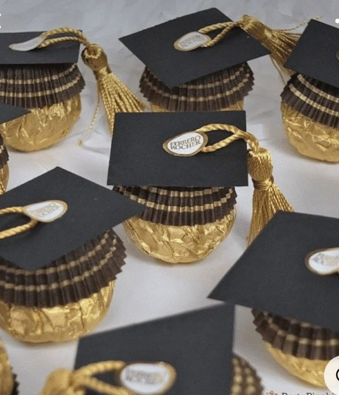 Gold wrapped chocolates topped with miniature black graduation caps and gold tassels.