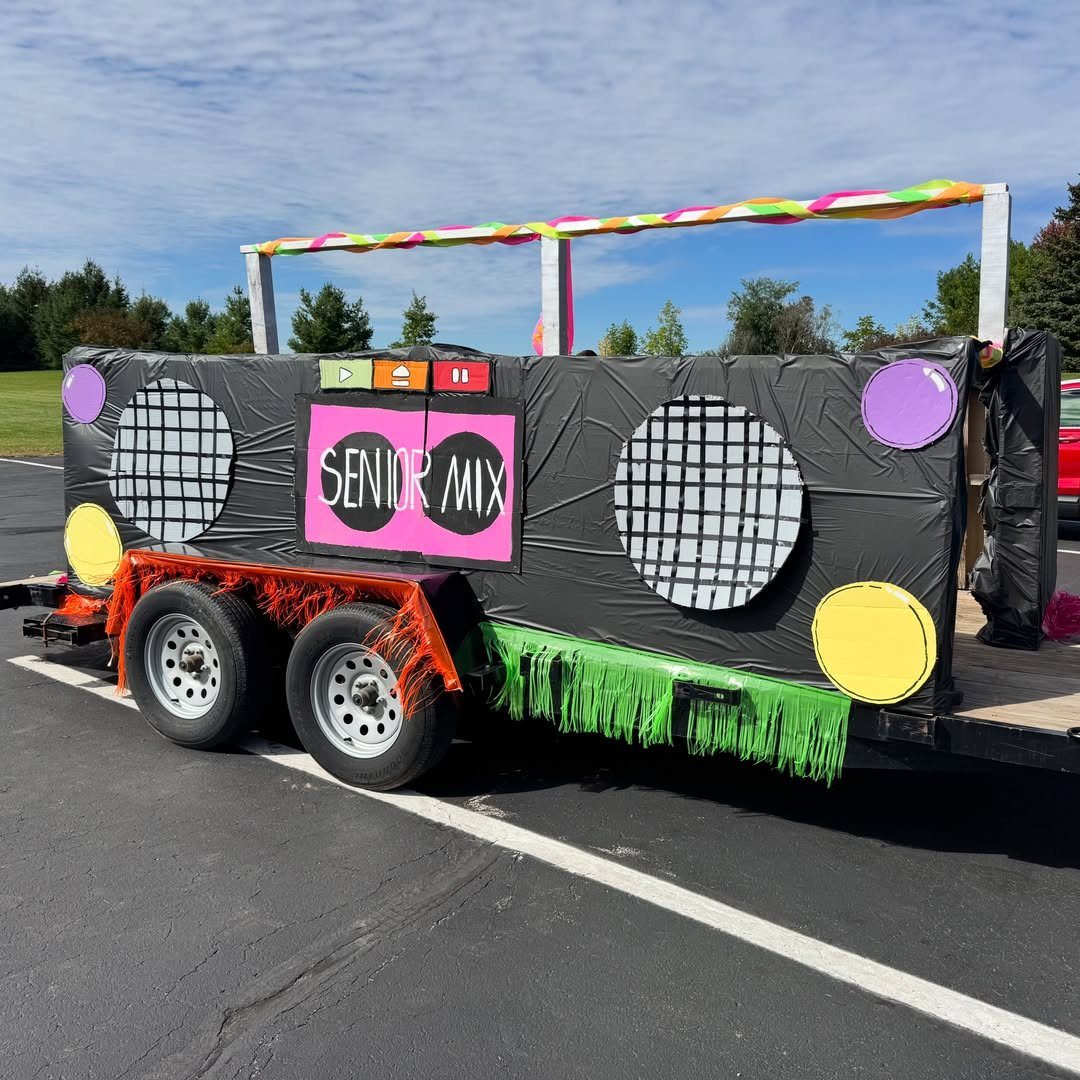 A homecoming class float designed as a giant stereo with a Senior Mix sign.