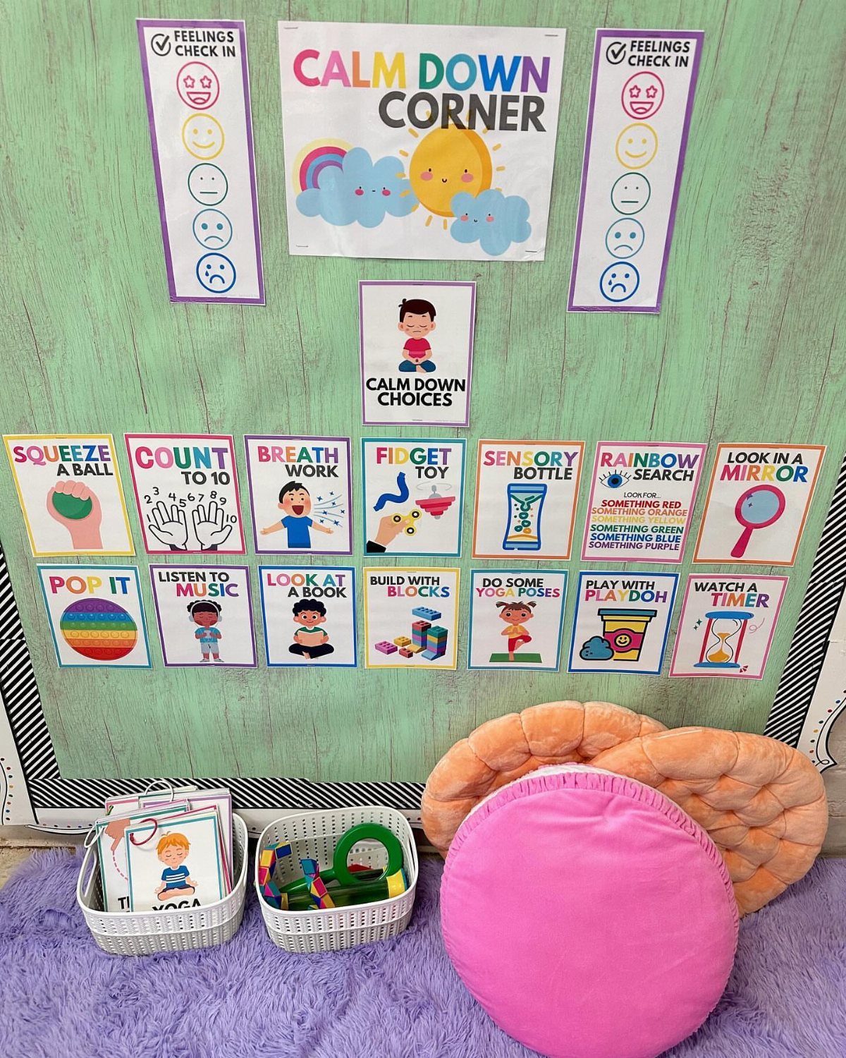 Calm down corner with activity cards, feelings charts, and plush cushions on purple rug.