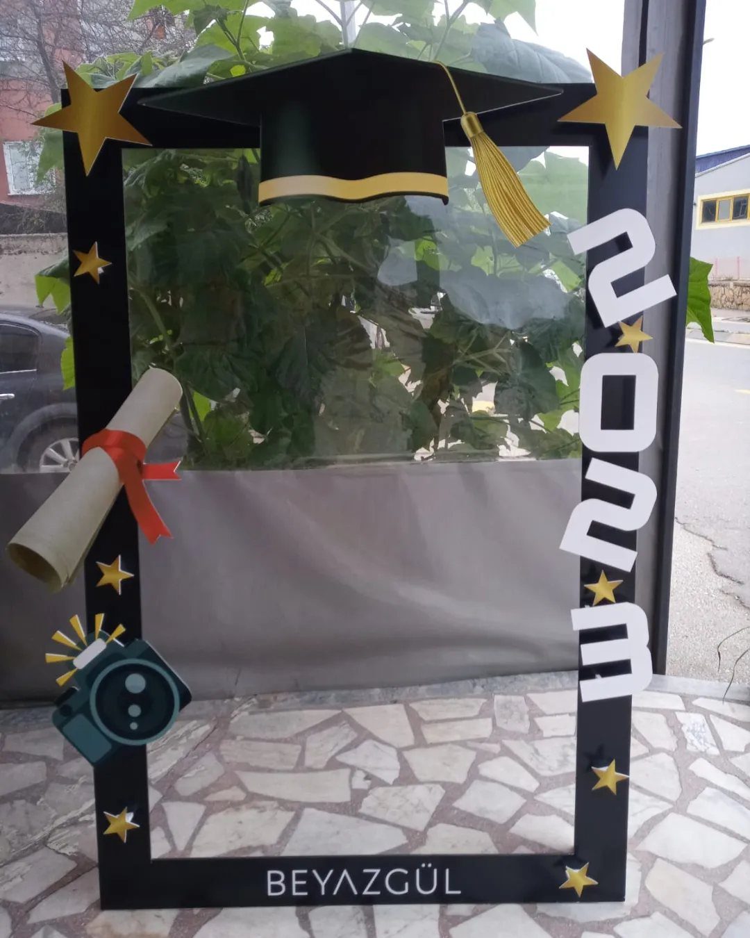 Graduation photo booth frame with a cap, diploma, and the year 2023.