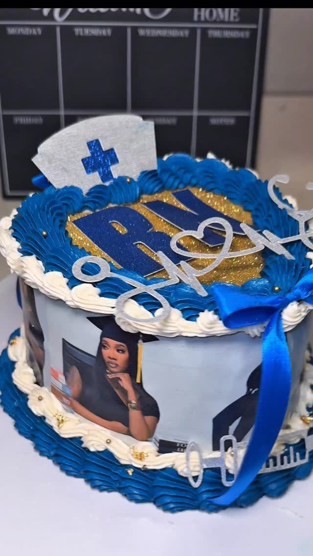 Nursing graduation cake with blue frosting, edible photos, and a nurse's hat topper.