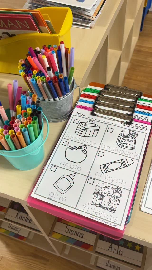 Worksheet with picture clues for a classroom scavenger hunt on a colorful clipboard.