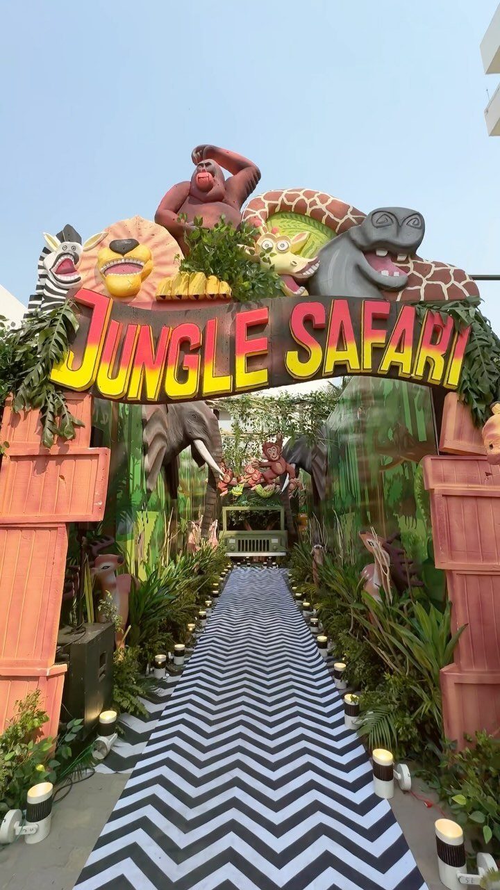 Jungle Safari entrance with cartoon animal decorations and a chevron patterned walkway.