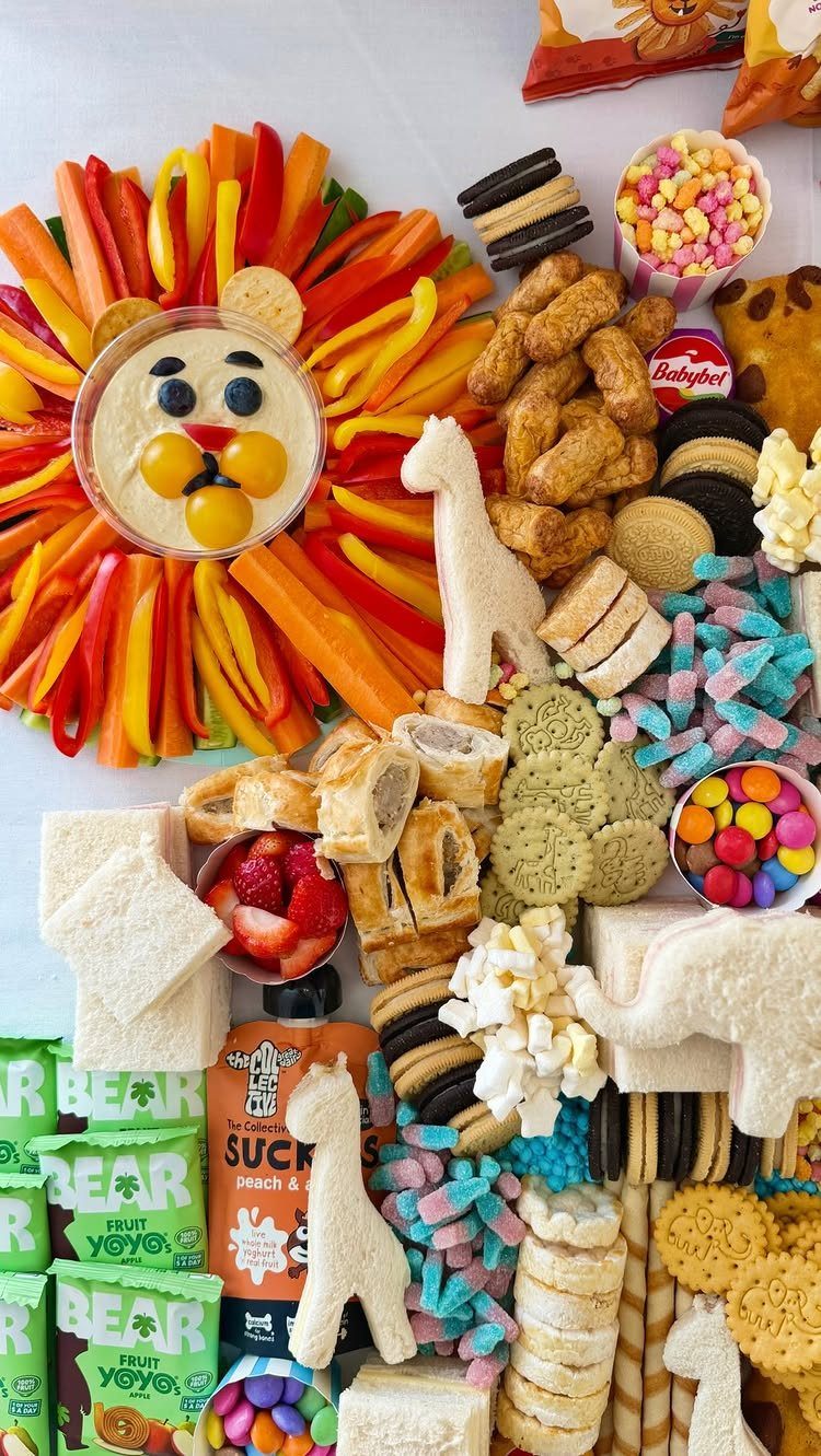 Safari themed snack platter featuring a hummus lion and animal shaped crackers.