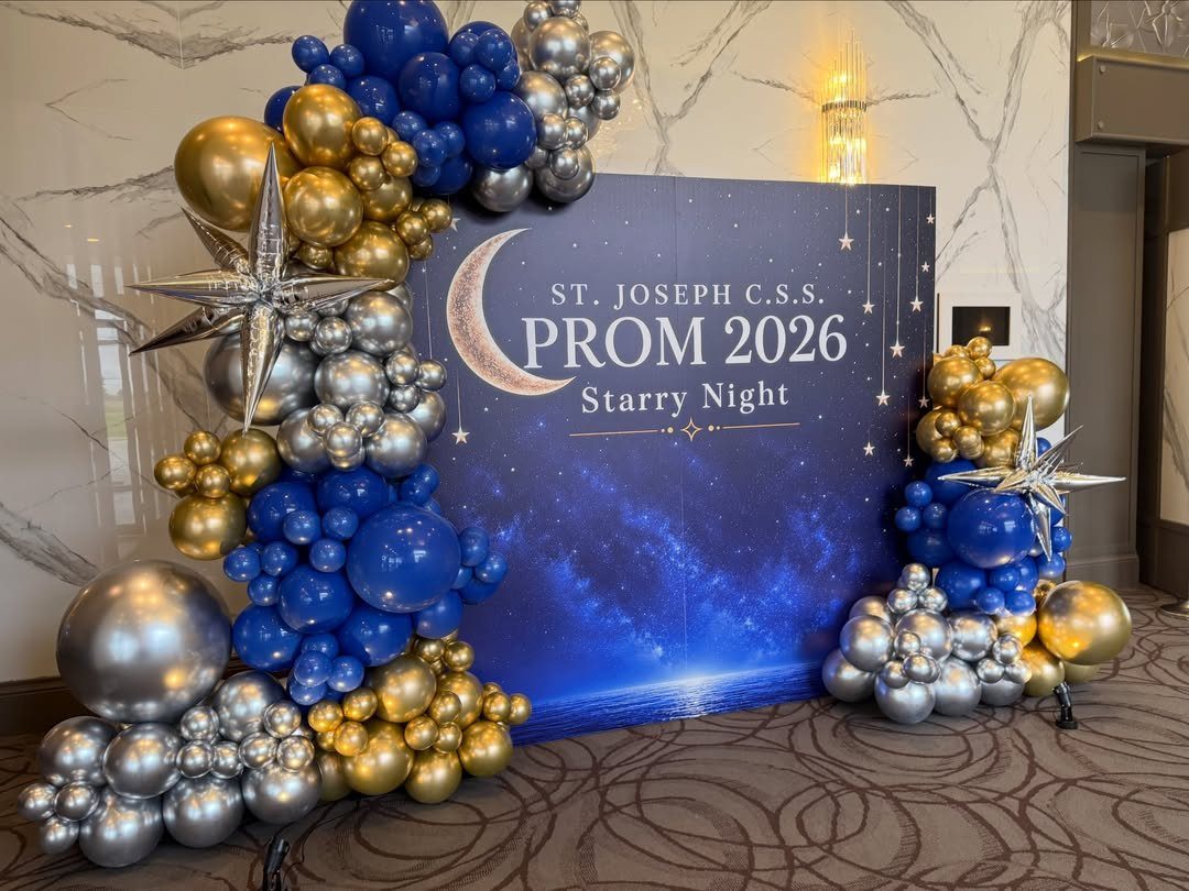 Prom photo backdrop with starry night theme, blue gold and silver balloons