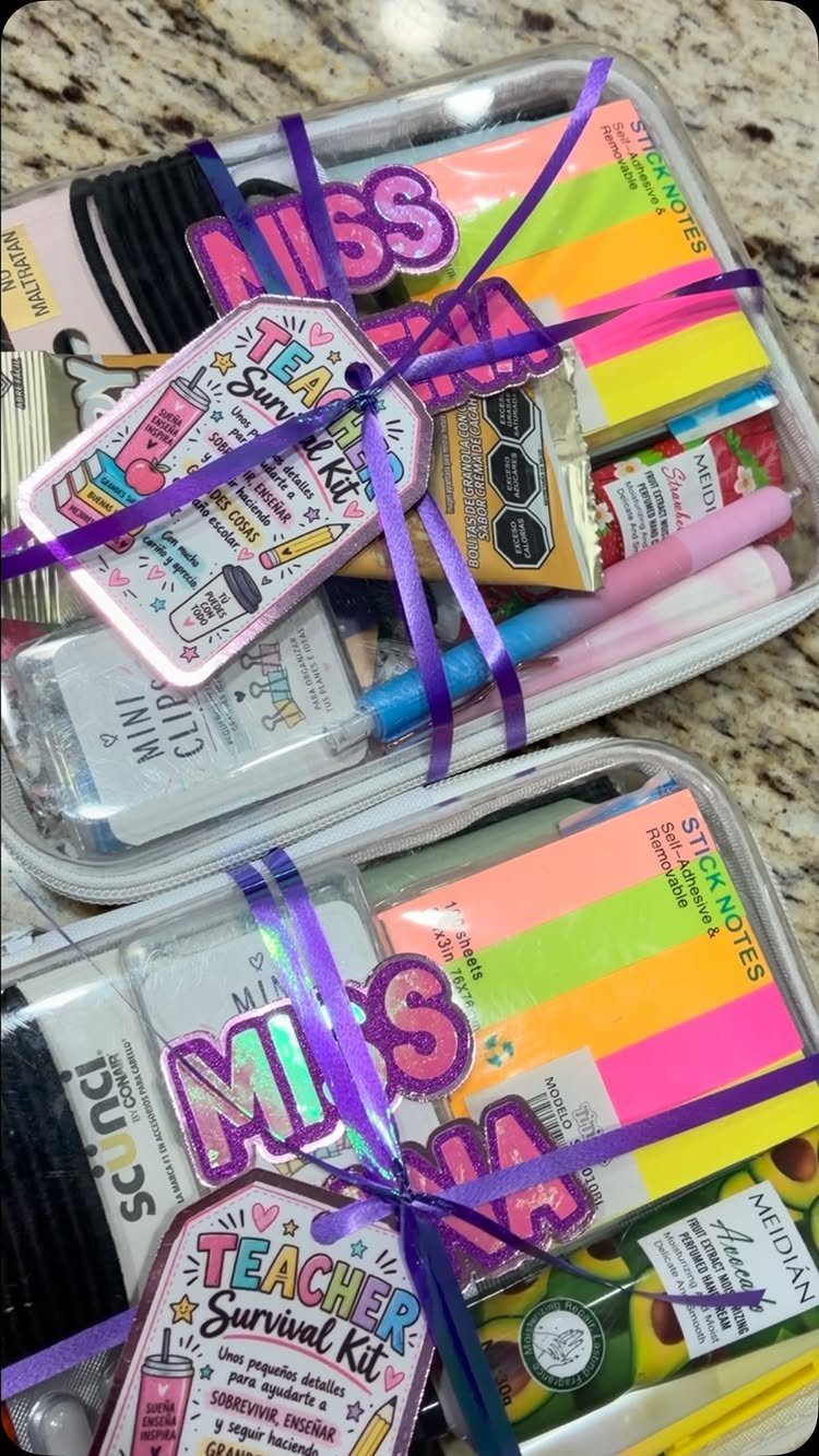 Teacher survival kits in clear plastic bins with colorful stationery and purple ribbons.