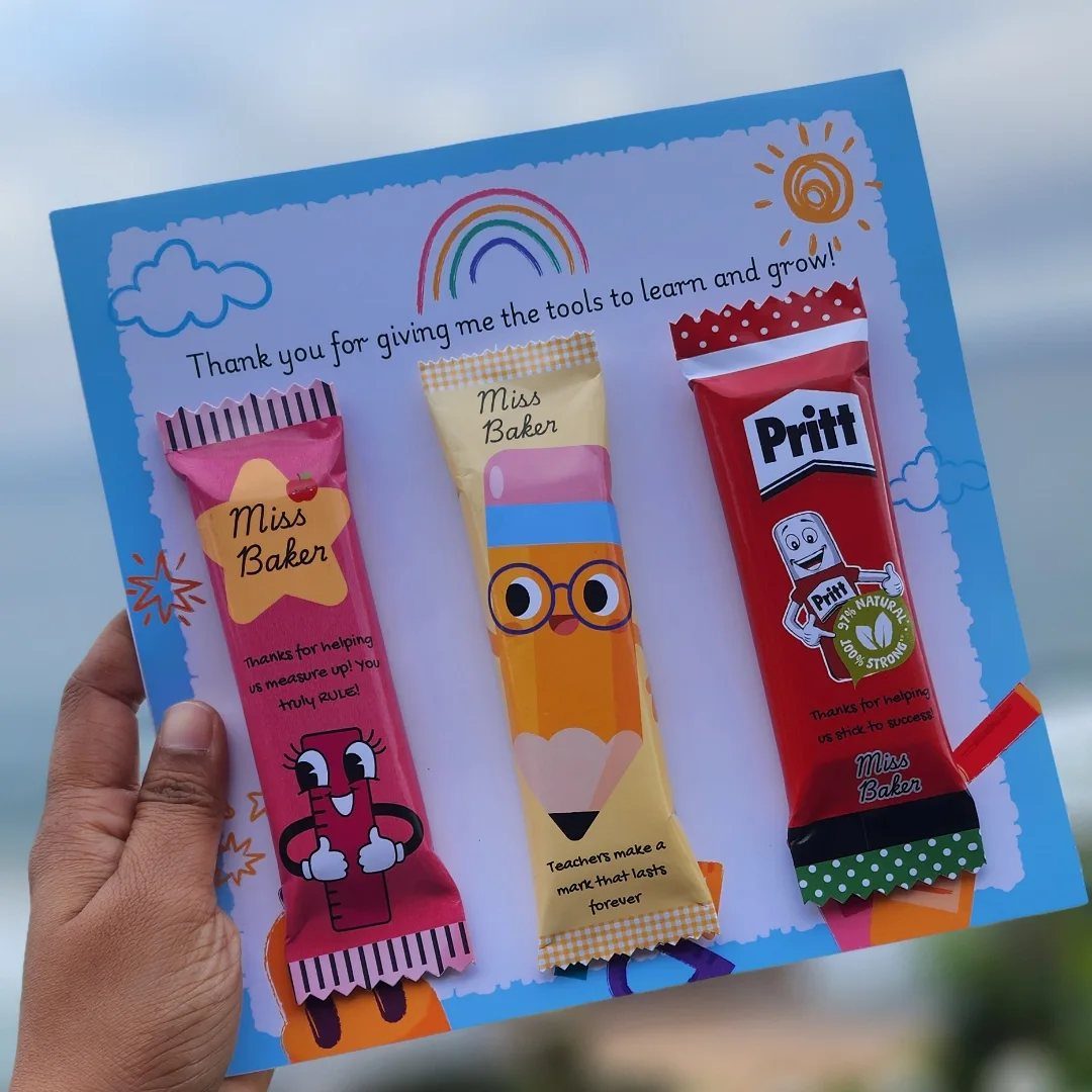 Customized candy bar gift card for Miss Baker with school-themed wrappers and rainbow.