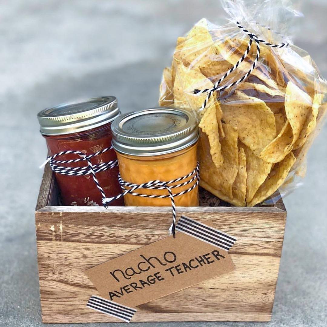 Wooden gift crate with tortilla chips, salsa, cheese dip, and teacher appreciation tag.