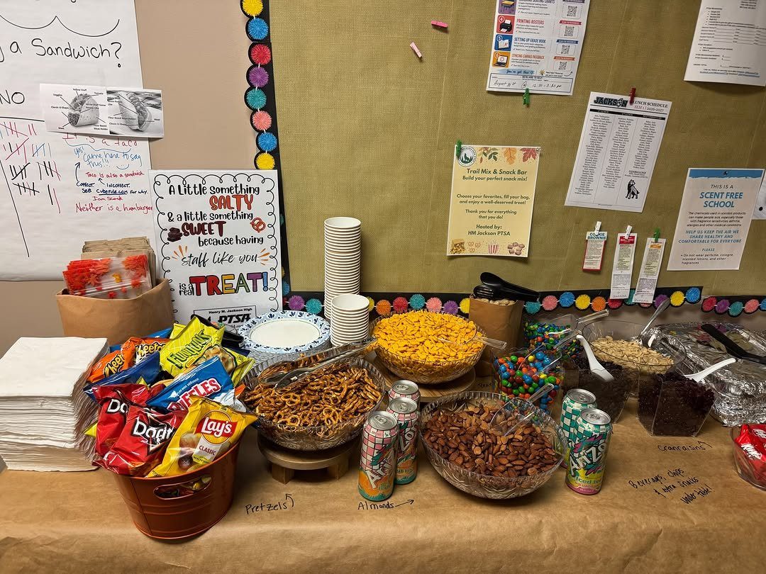 Snack bar with bowls of nuts, pretzels, and candies for teacher appreciation.