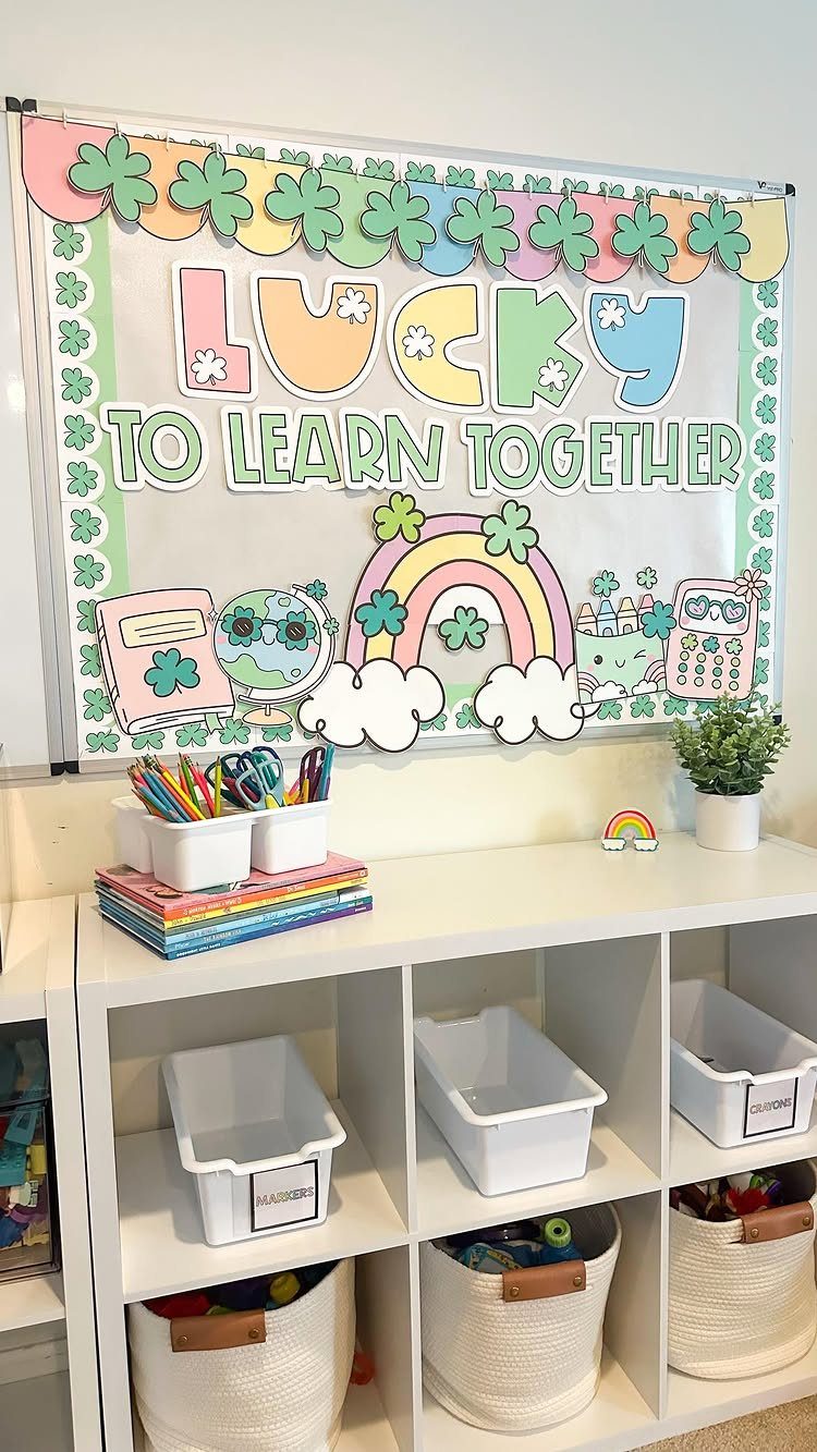 Classroom display banner with St. Patrick's Day theme hanging above white storage cubbies.