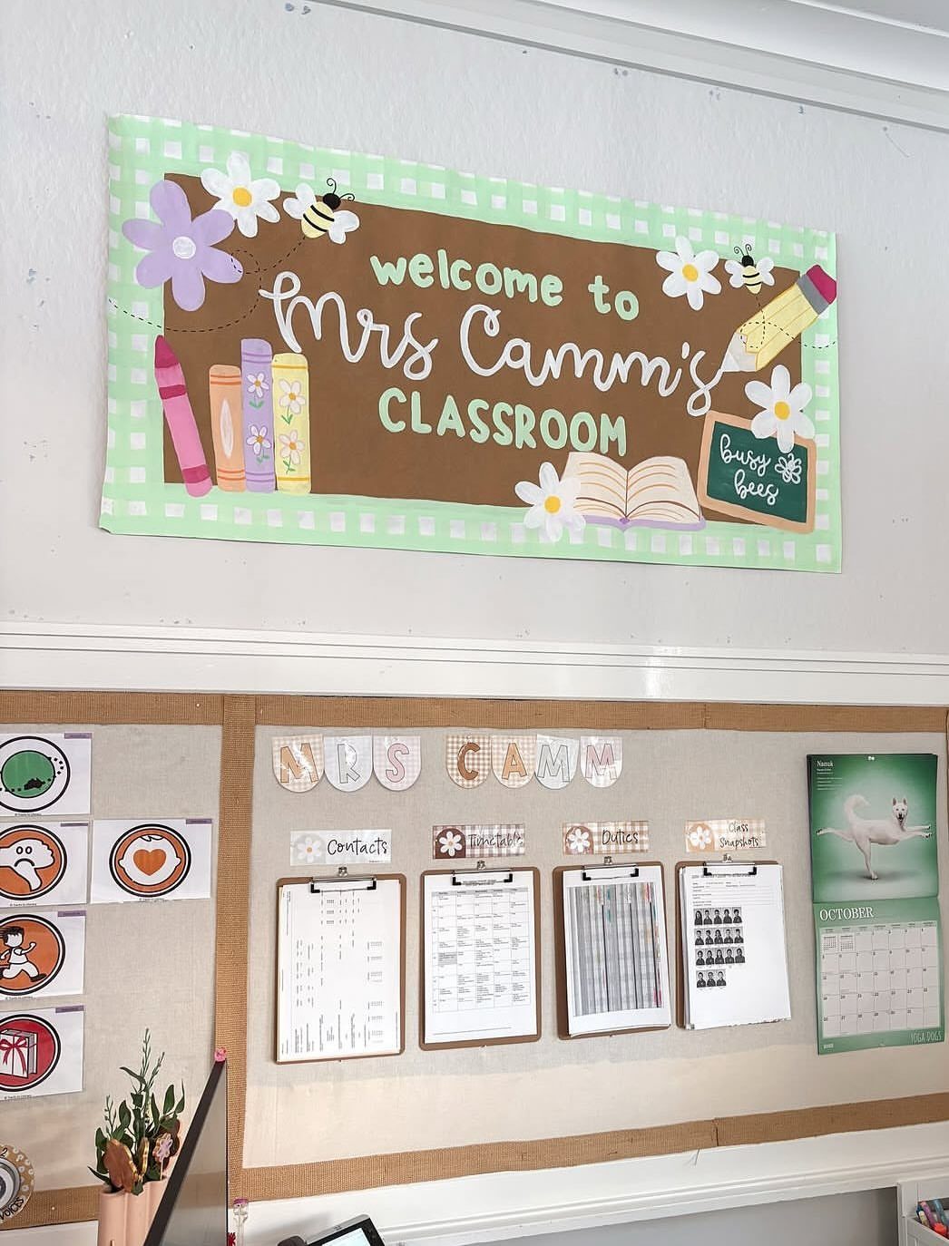 Welcome banner for Mrs Camm's classroom with bees and flowers on a wall