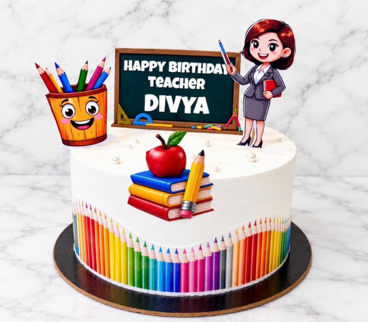 White birthday cake with a chalkboard topper, red apple, and colorful pencil decorations.