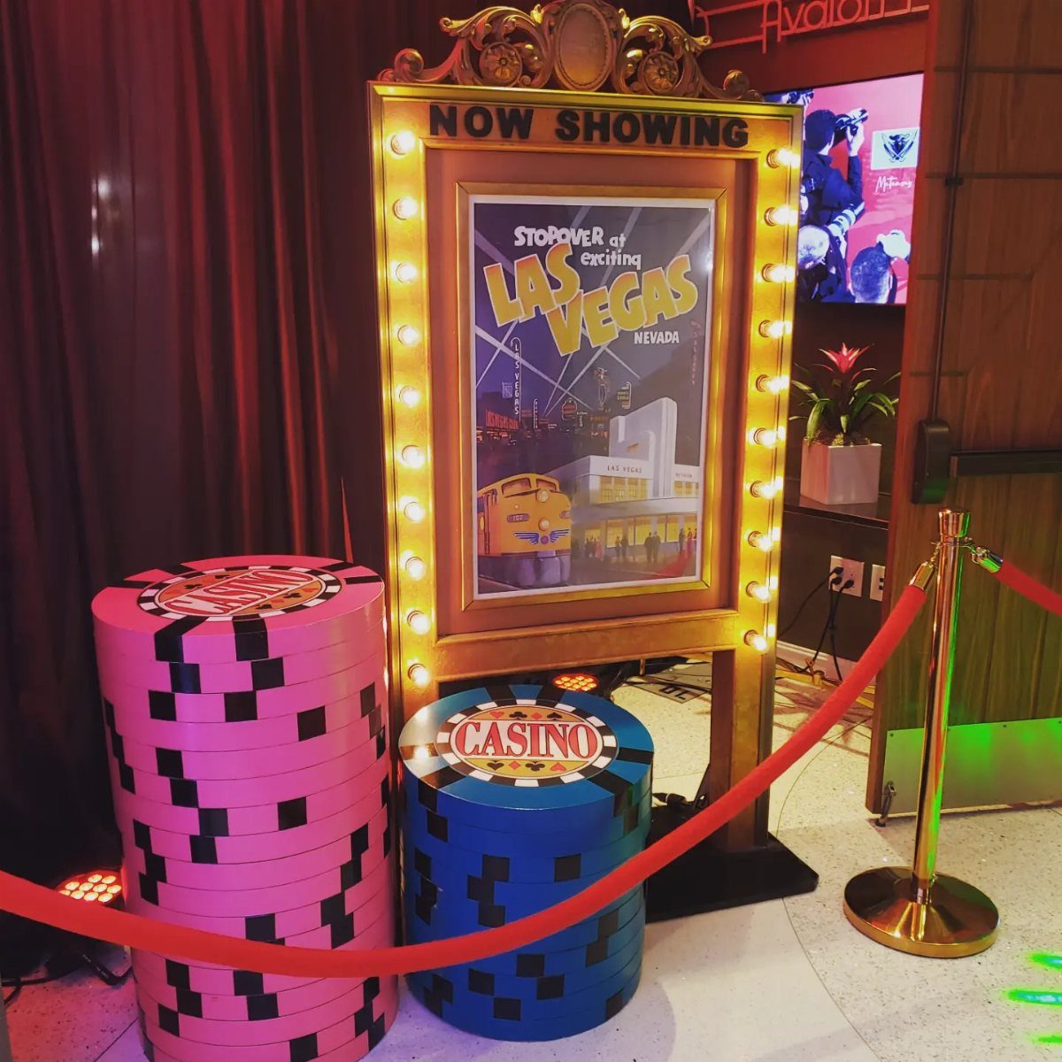 Las Vegas themed decor with oversized casino chips and a gold marquee sign.