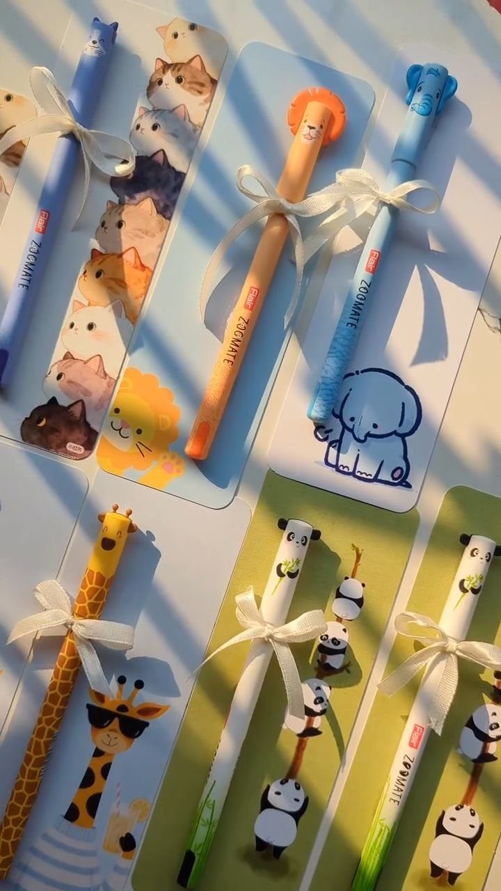 Animal themed pens with white ribbons on matching illustrated cards for teachers