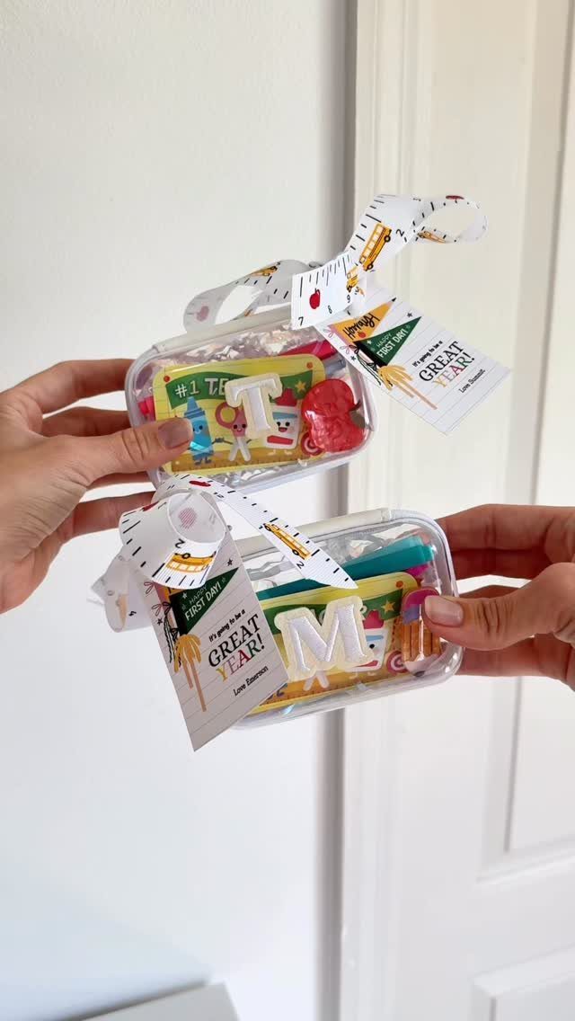 Clear pencil cases filled with school supplies and gift tags for teachers.