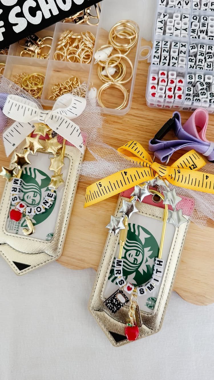 Personalized Starbucks gift cards with custom name beaded keychains and gold holders.